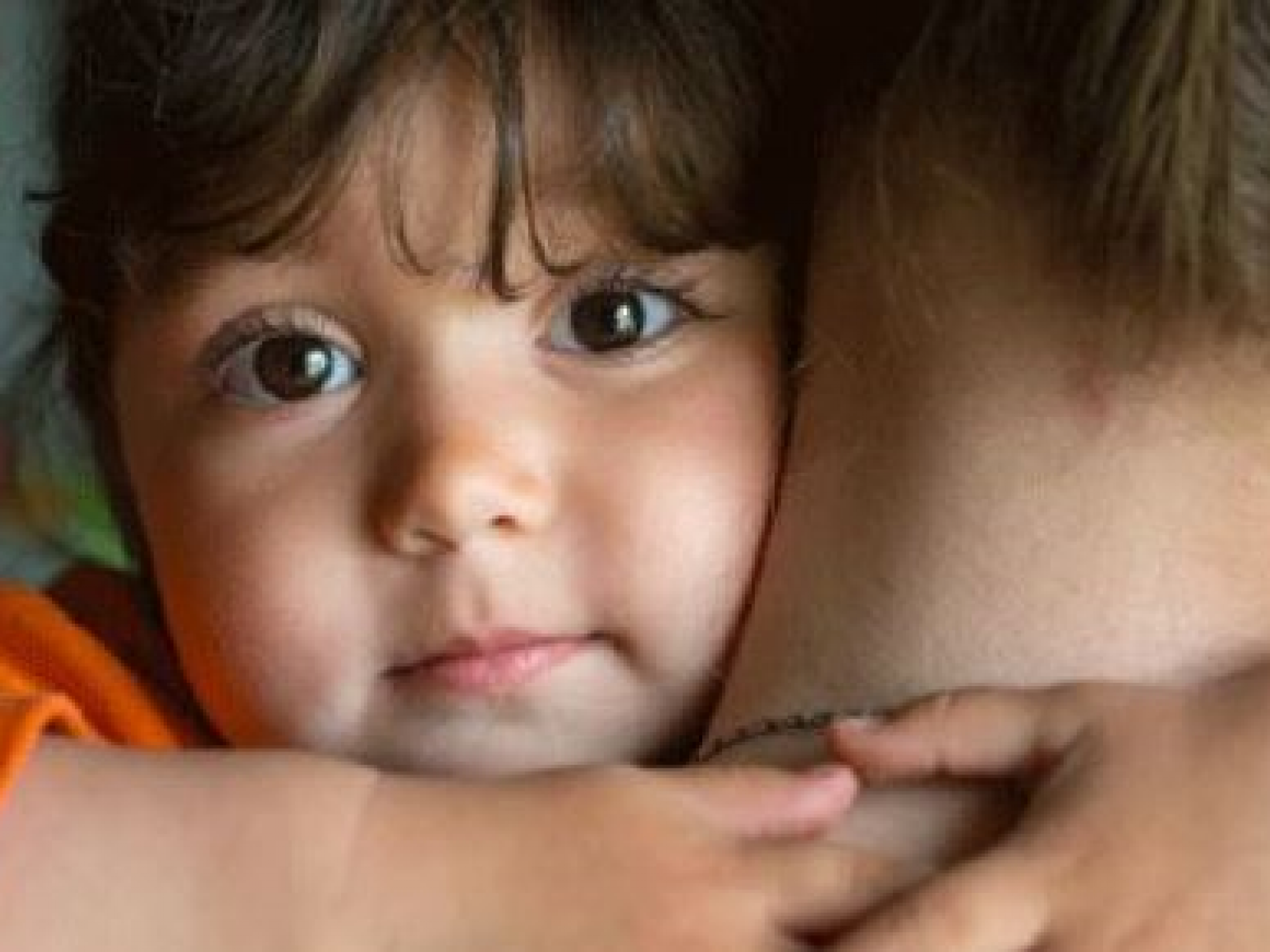 A Child Hugging a Parent
