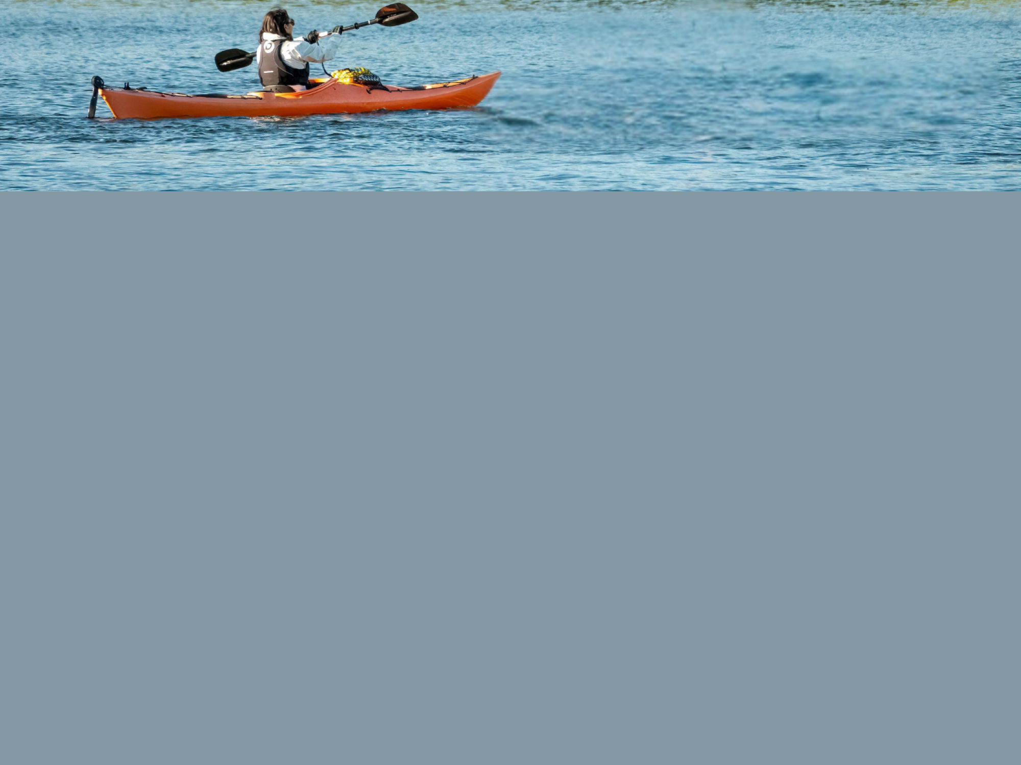 Kayaker on lake. 
