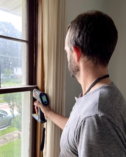 Inspector testing window sash